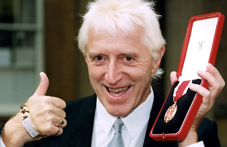 Savile with medal in 1990