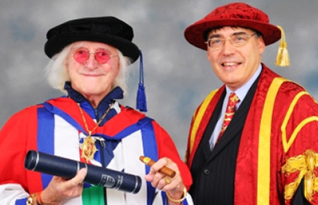 Savile is presented with Bedforshire University's honorary doctorate