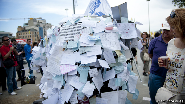 Burnt out truck covered in notes